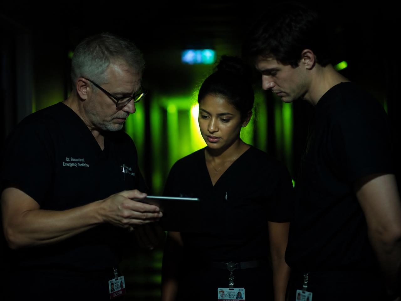 Two colleagues reviewing an onboarding handbook together